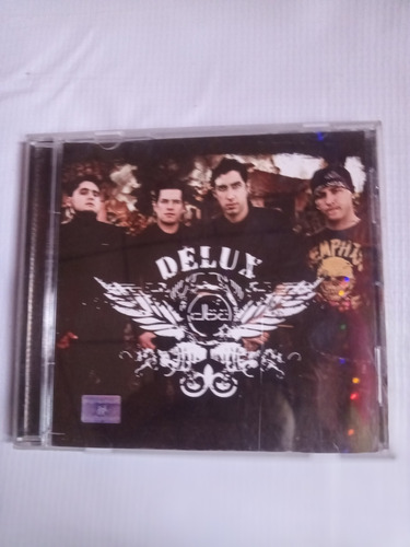 Delux Entre La Guerra Y El Amor Disco Compacto Original (Usado)