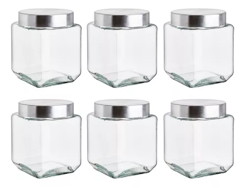 frascos de vidrio para almacenar alimentos en un estante de cocina