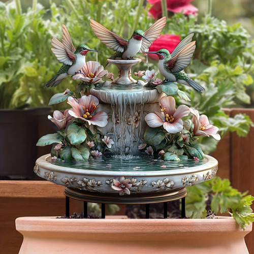 * Estatua De Un Colibrí Jugando En El Agua En Un Jardín Con