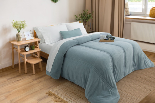 Acolchado Alcoyana Essencia Amsterdam 1 1/2 plaza diseño lisa color celeste de 170cm x 240cm