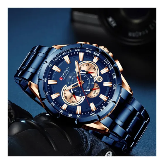 Reloj pulsera Curren KREc9503 con correa de acero inoxidable color dorado - fondo azul