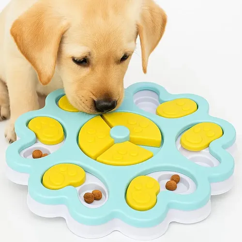 Puppy using an interactive food puzzle enrichment toy