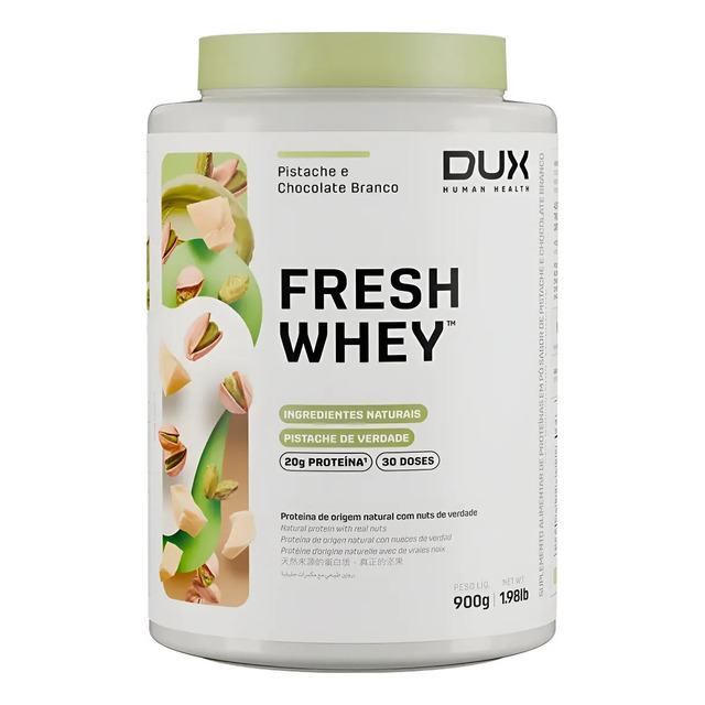 Pote de 900g de Whey Protein Dux sabor Pistache e Chocolate Branco com ilustração de pistaches e pedaços de chocolate branco ao lado