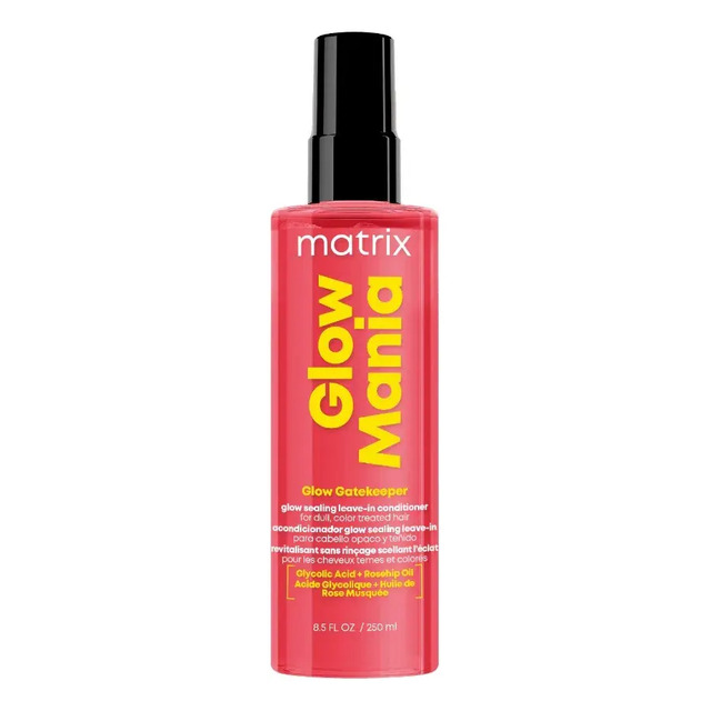 Frasco cilíndrico de spray Leave-in Matrix Glow Mania na cor rosa vibrante com tampa preta e rótulo amarelo