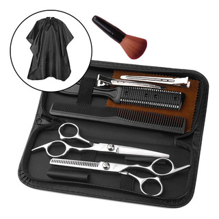 & Um Conjunto De Tesouras De Barbeiro Para Cortar Cabelo & Um Conjunto De Tesouras De Barbeiro Para Cortar Cabelo