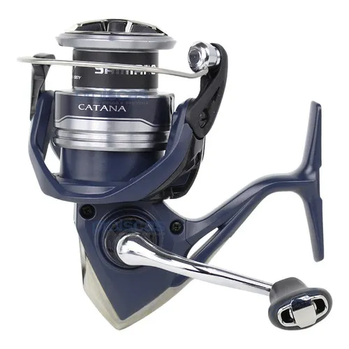 Shimano New Catana Fe 2500 Hg Fe Drag, 4 kg, 6. 2:1 en color plateado y azul, lado de la manivela derecha/izquierda