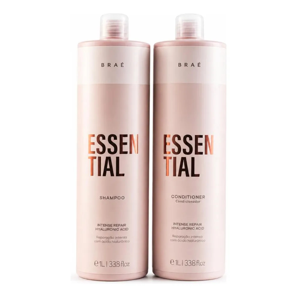 Frascos de 1 litro do shampoo e condicionador Braé Essential Duo, ambos na cor rosa claro com rótulos contendo a descrição de reparação intensa com ácido hialurônico.