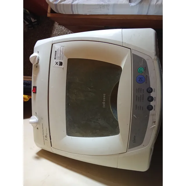 Lavadora Usada Para Reparar Problemas En La Caja.