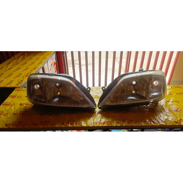Par De Faros Delanteros Para Renault Logan 2008 Originales