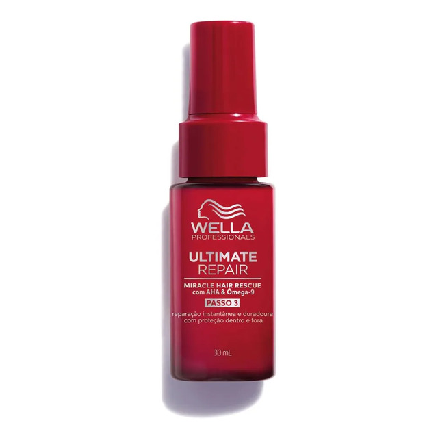 Frasco spray vermelho do tratamento capilar Wella Ultimate Repair Miracle Hair Rescue de 30ml em fundo branco