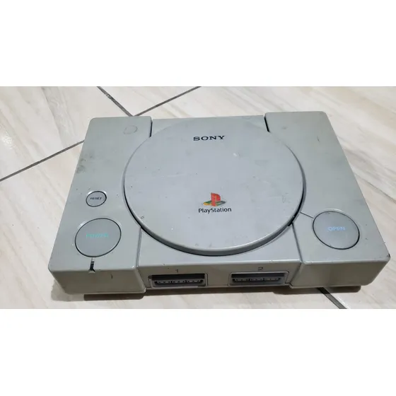 Playstation 1 Fat Só O Aparelho. O Leitor Não Leu Os Jogos. Tá Com Defeito. 653.  M38