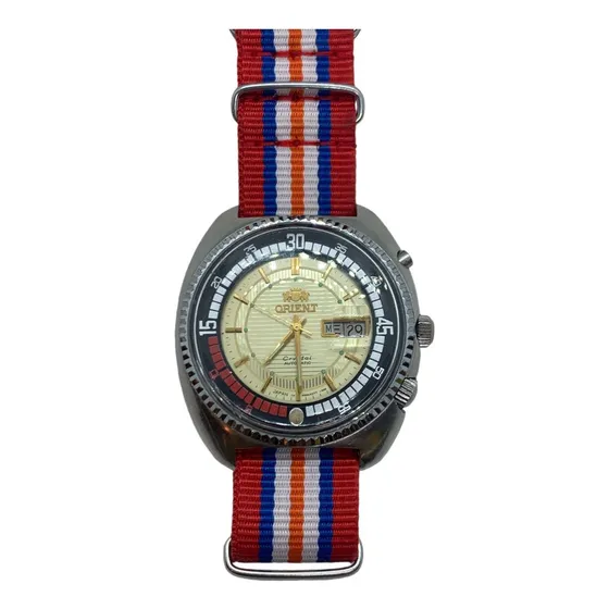 Reloj Orient Crystal Autómatico Extensible De Tela Vintage Correa Colores A Rayas Bisel Plateado Fondo Dorado