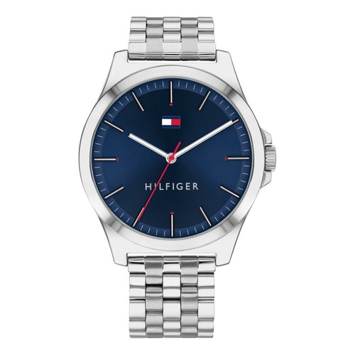 Reloj pulsera Tommy Hilfiger 1791713 con correa de acero inoxidable color plateado - fondo azul