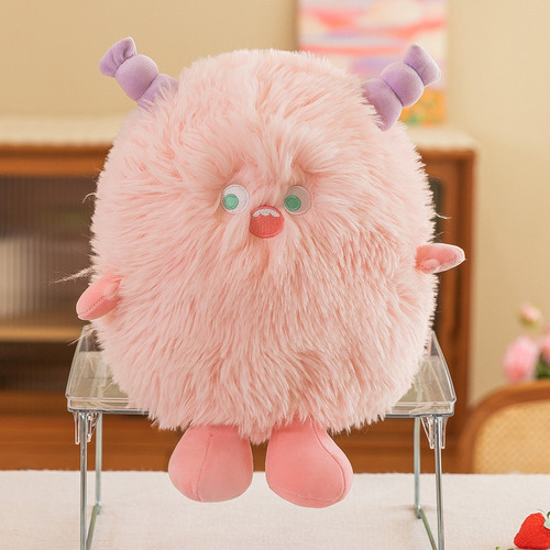 Un Pequeño Animal De Peluche Con Forma De Monstruo Peludo Pa Color Rosa