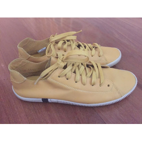 tenis osklen feminino amarelo