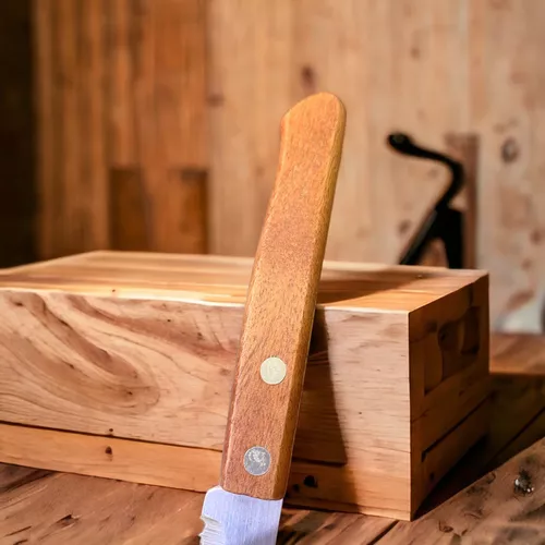 Cuchillo de mesa con filo de sierra de acero inoxidable y mango de madera  0.85 euros