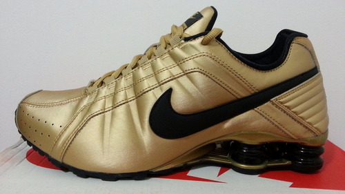 nike shox doradas