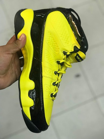 jordan negras con amarillo