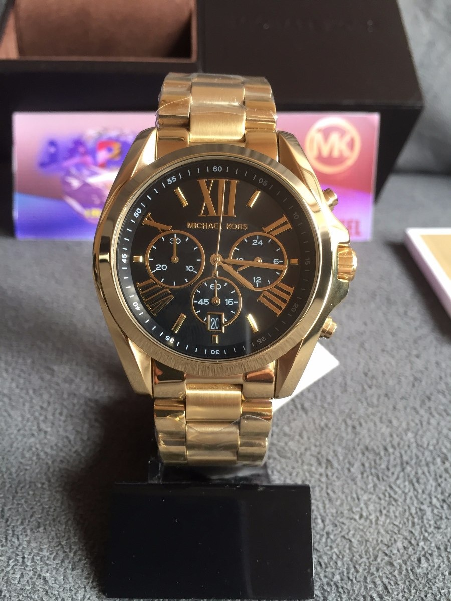 relogio michael kors dourado fundo preto