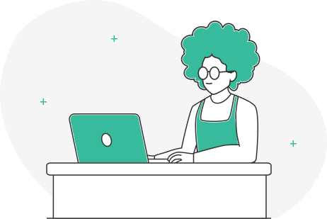 Mujer con anteojos usando laptop en una mesa