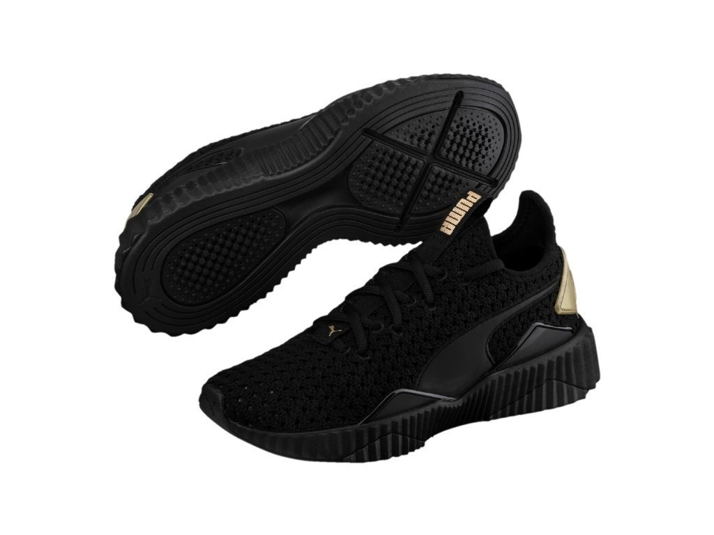 tenis puma negro con dorado